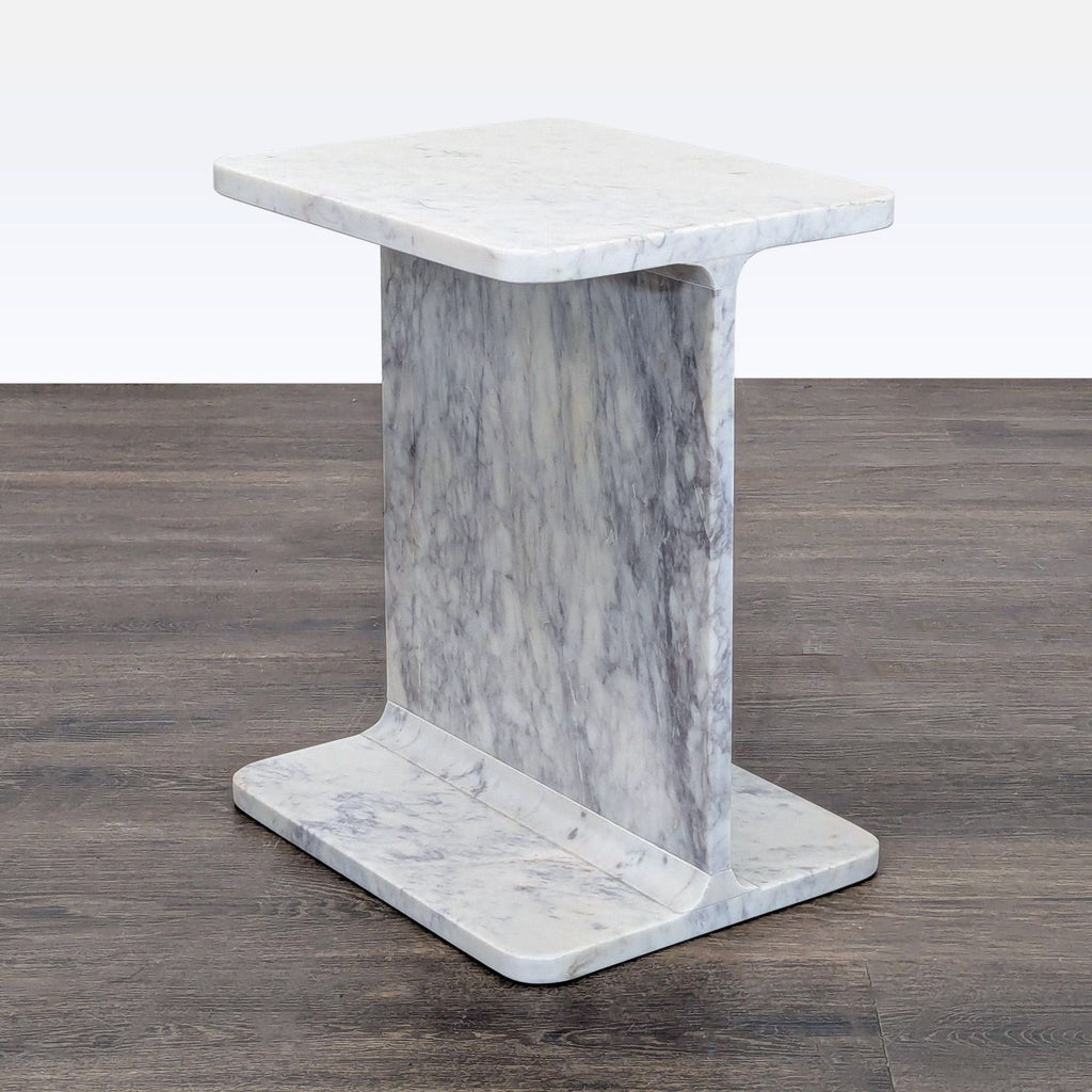 1. Nadaal side table in solid marble with a bold I-beam design, perfect for modern interiors.  