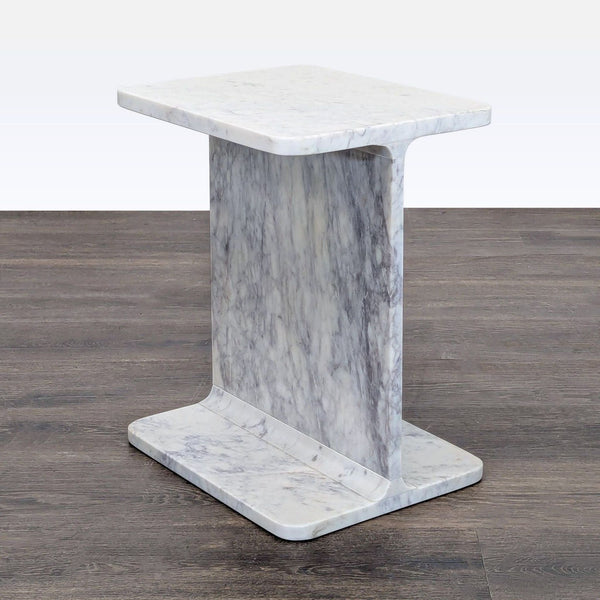 1. Nadaal side table in solid marble with a bold I-beam design, perfect for modern interiors.  