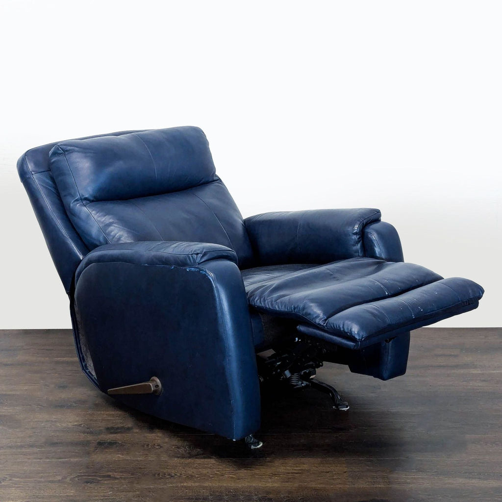 Southern Motion blue recliner lounge chair featuring adjustable back, plush cushioning, and sleek leather upholstery.  