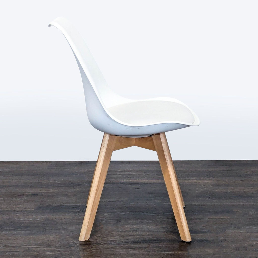 Contemporary dining chair with soft cushion, sturdy beech wood legs, and a matte polypropylene seat.