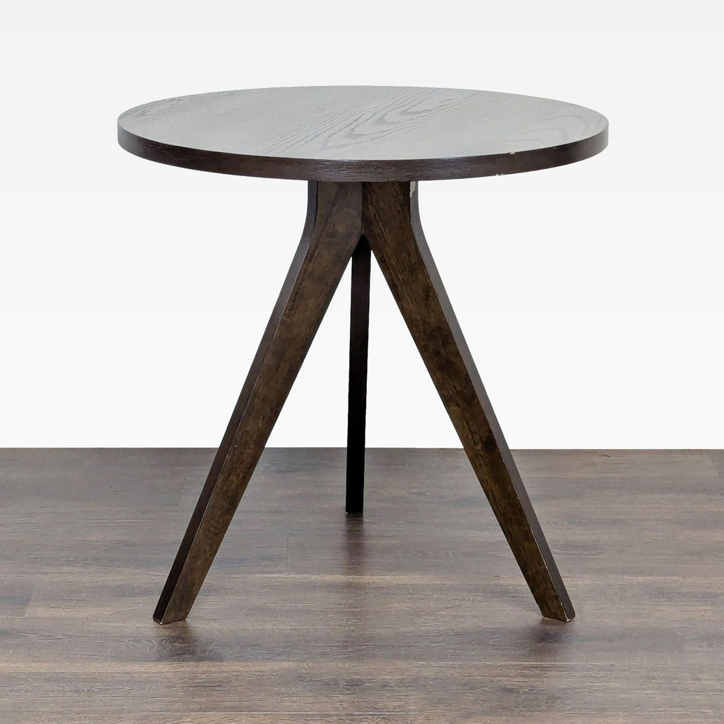 1. West Elm dining table with walnut wood veneer and striking angular legs in a modern design.  