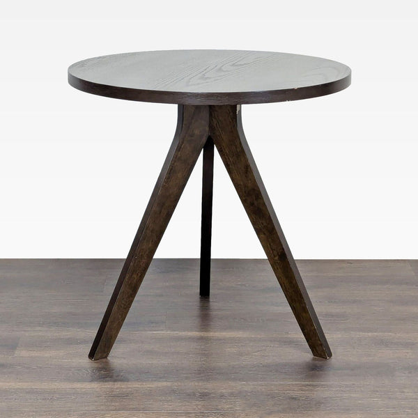 1. West Elm dining table with walnut wood veneer and striking angular legs in a modern design.  