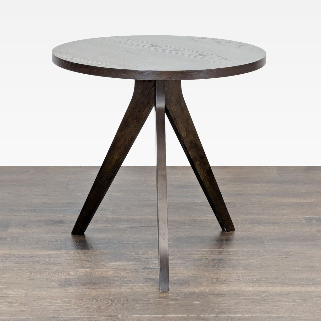 2. Contemporary dining table by West Elm, featuring a walnut veneer finish and unique slanted legs.  