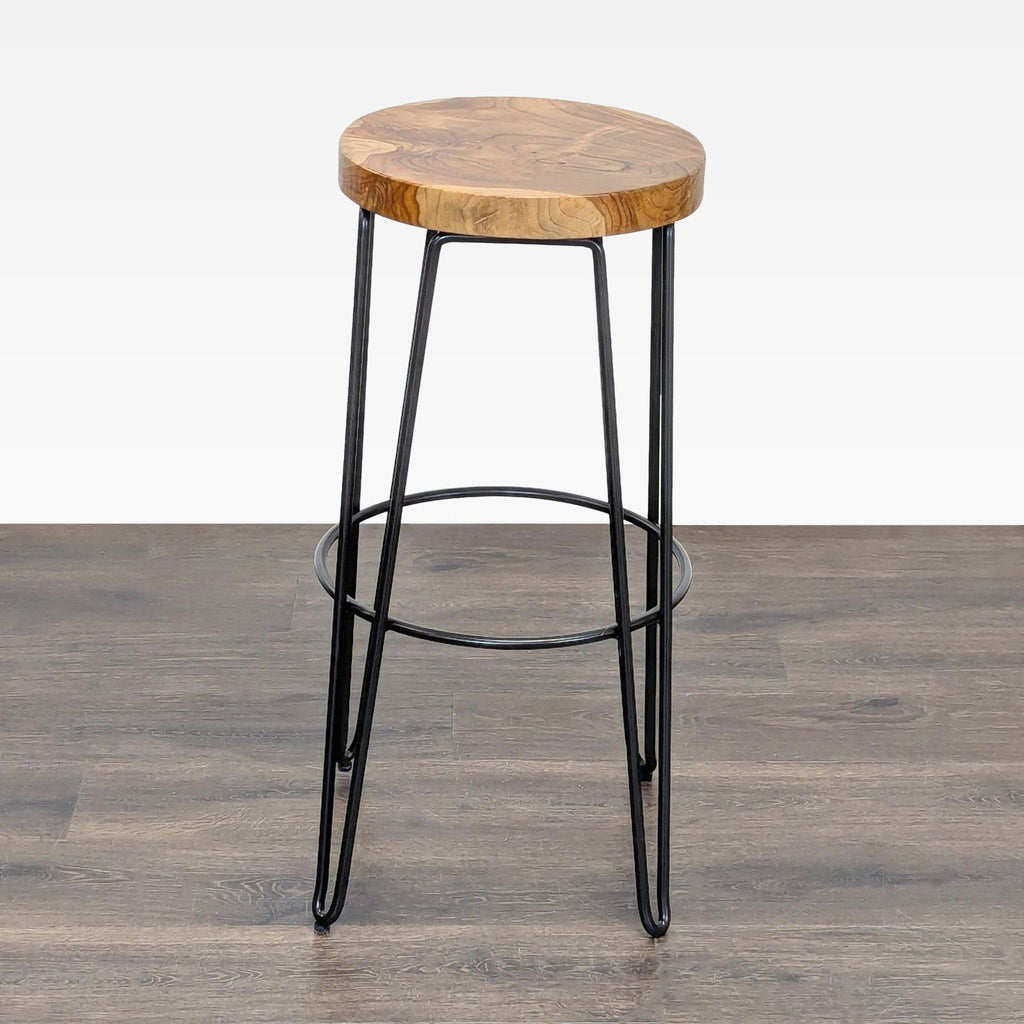 Crate & Barrel industrial stool featuring a wooden seat, perfect for stylish seating in any room.  