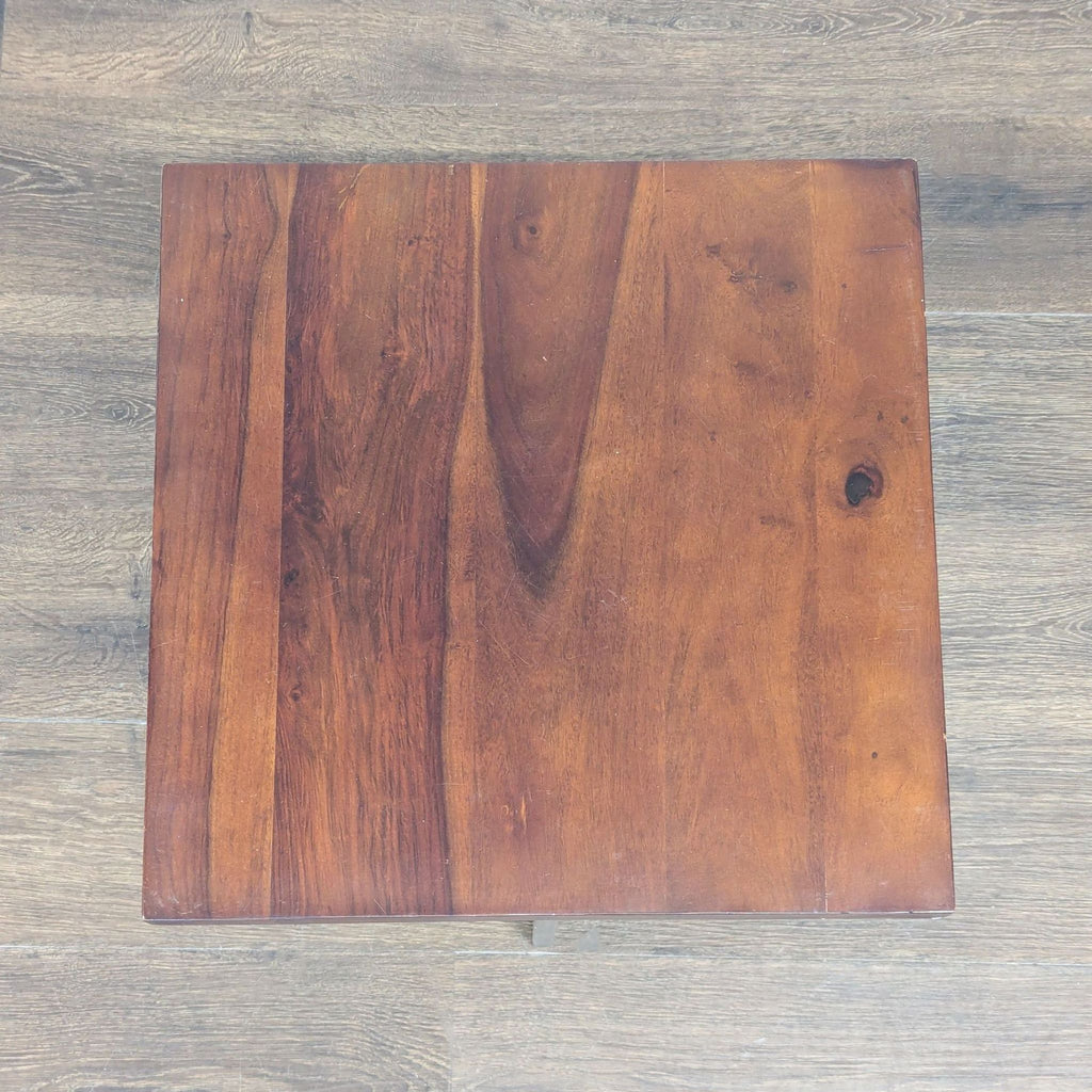 3. Top-down view of a square wooden end table, highlighting its rich natural grain and smooth finish.