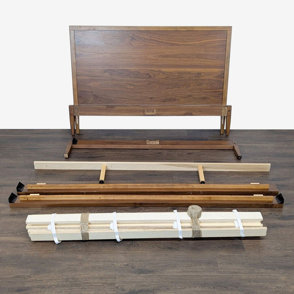 Matthew Kroeker wooden bed frame with headboard and side rails, natural finish, mattress not included.