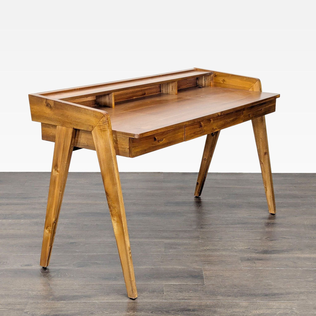 Mid-century modern CB2 desk with three built-in drawers and top shelf, ideal for home office organization.