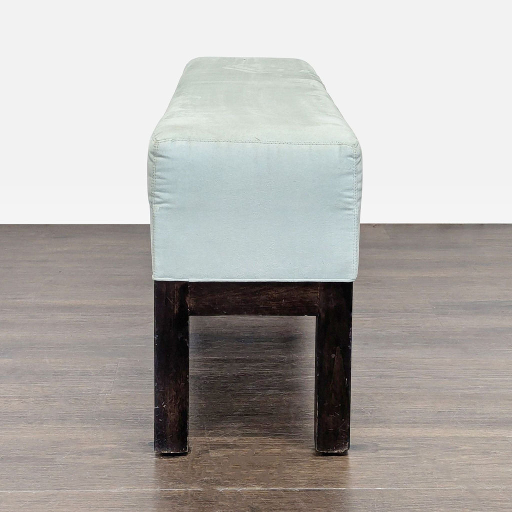 1. Upholstered ottoman by Cisco & Brothers, ideal for seating in modern living spaces.