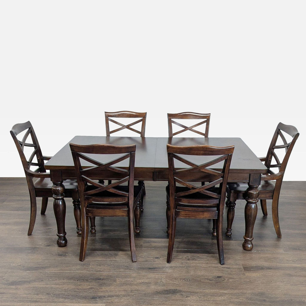Ashley Furniture dining set with dark wood table and six X-back chairs, ideal for dining rooms.  
