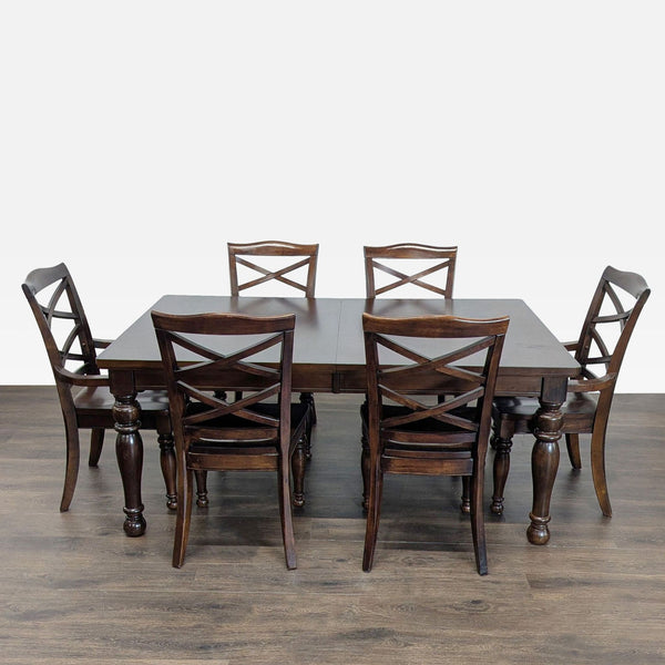 Ashley Furniture dining set with dark wood table and six X-back chairs, ideal for dining rooms.  