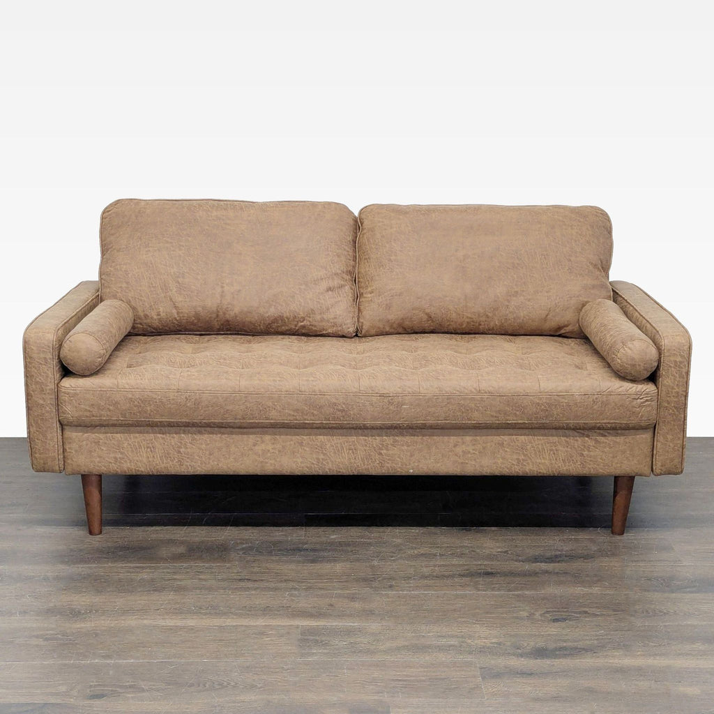 1. Front view of an Avantio 3-seat sofa in brown fabric with two seat cushions and bolster pillows.