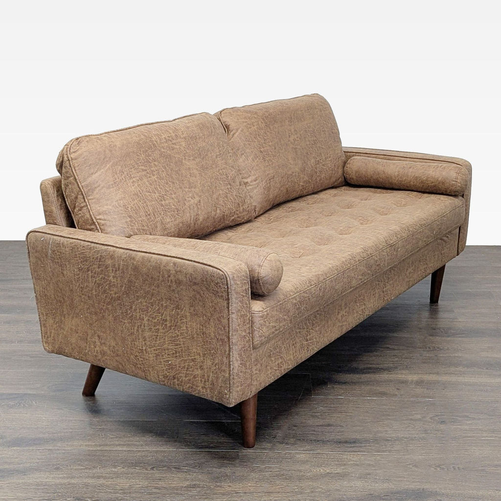 2. Angled side view of Avantio 3-seat sofa showing tufted seating, high arms, and wooden legs.