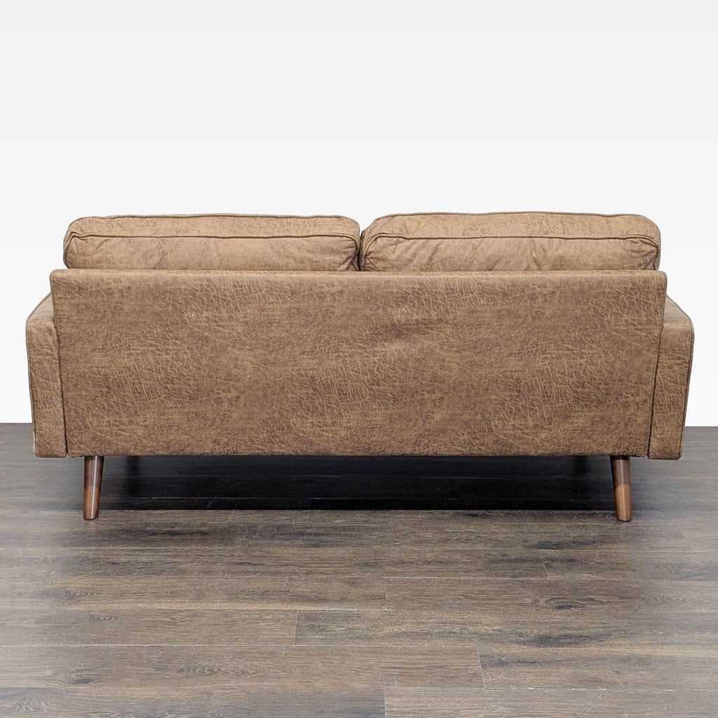 3. Rear view of the brown Avantio 3-seat sofa displaying its textured upholstery and slim profile.