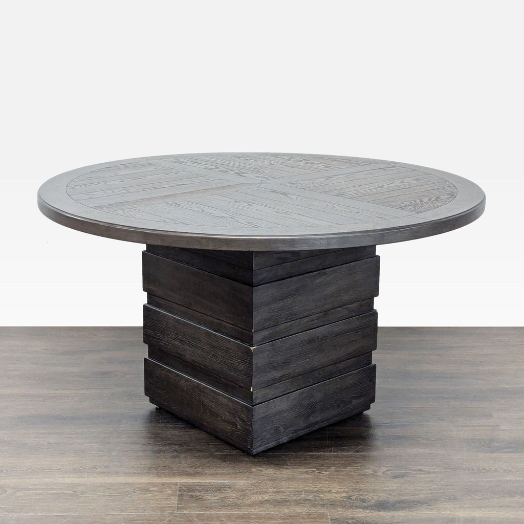 Dining table from Home Meridian with oak veneer, warm wood tone, and geometric stacked pedestal base design.