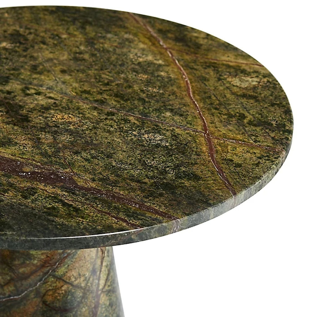 2. Close-up of a green marble table top with rust-colored veins from the Arteriors Home side table collection.
