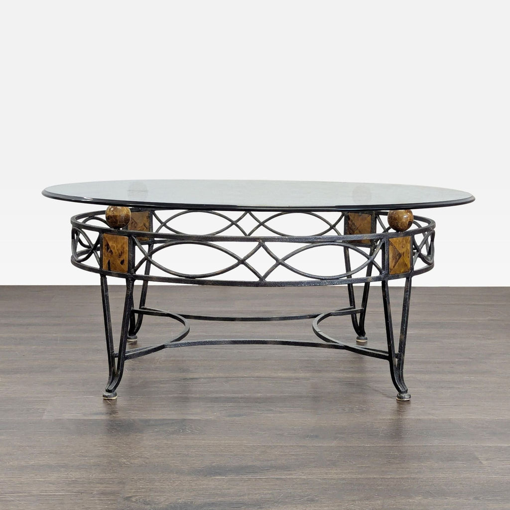1. Oval glass coffee table with a metal base featuring brown marble accents and decorative geometric patterns.  