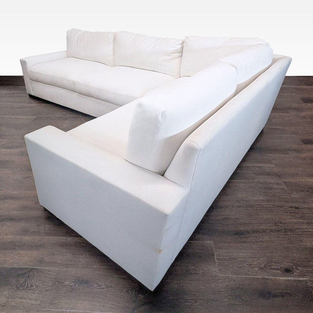 Modern white upholstered sectional sofa by Restoration Hardware, featuring deep cushions and supportive back for comfort.