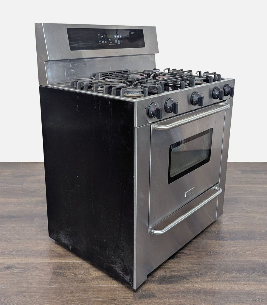 3. Modern Frigidaire oven and stove combo with easy-access broiler/storage drawer and five-burner cooktop.