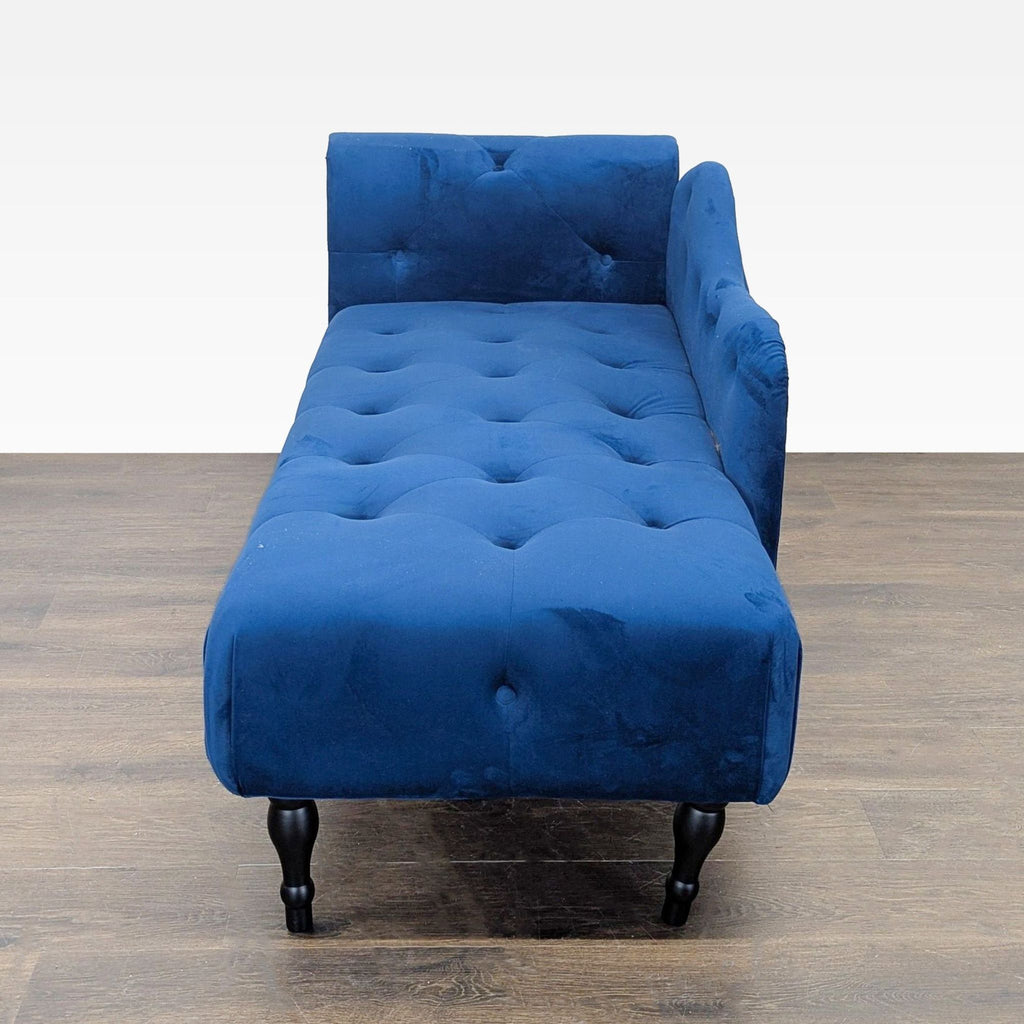 3. Modern blue velvet chaise lounge with tufted details and one raised armrest, perfect for stylish living rooms.