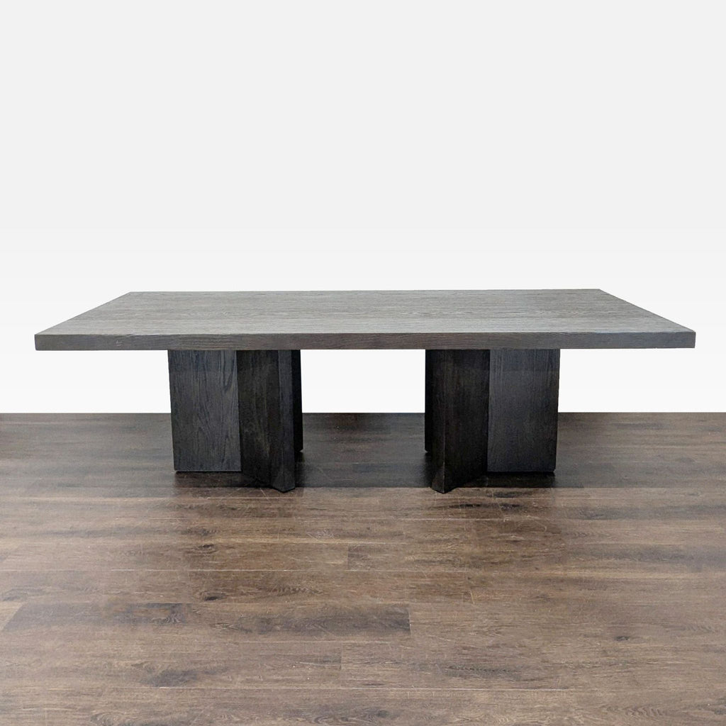 1. Rectangular dark wood dining table by Restoration Hardware with thick top and geometric pedestal legs.