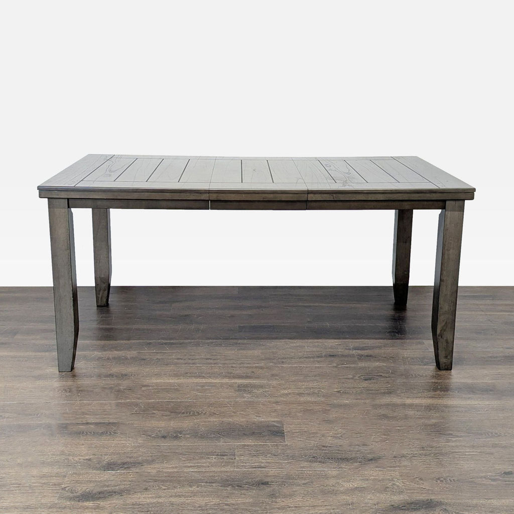 3. Front view of Crown Mark dining table in gray wood, from the Dining Table category, with one leaf.