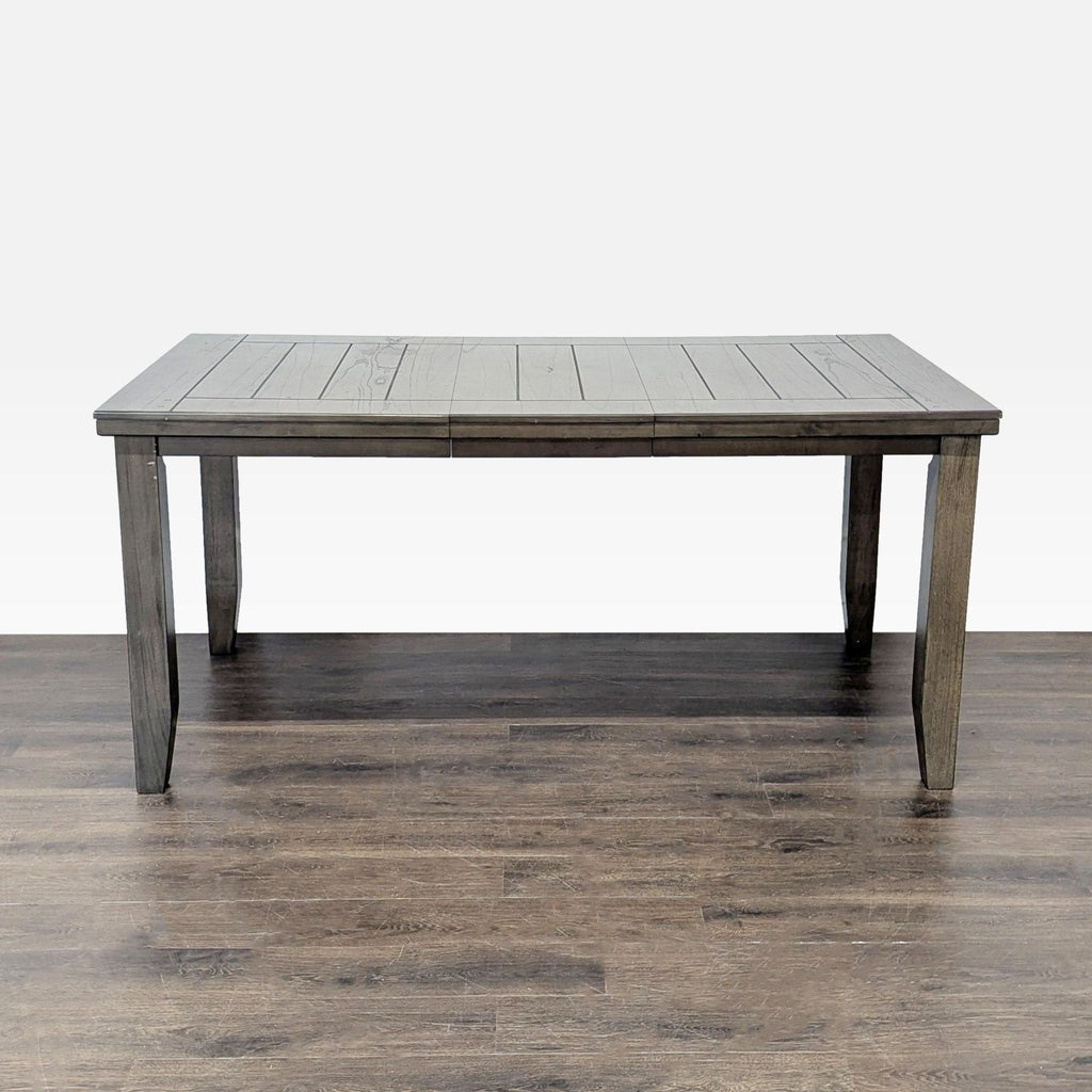 1. Rectangular Crown Mark dining table with one leaf, featuring a gray wood finish and straight legs.  