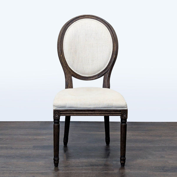 French-style upholstered dining chair with carved wood, by Restoration Hardware.  