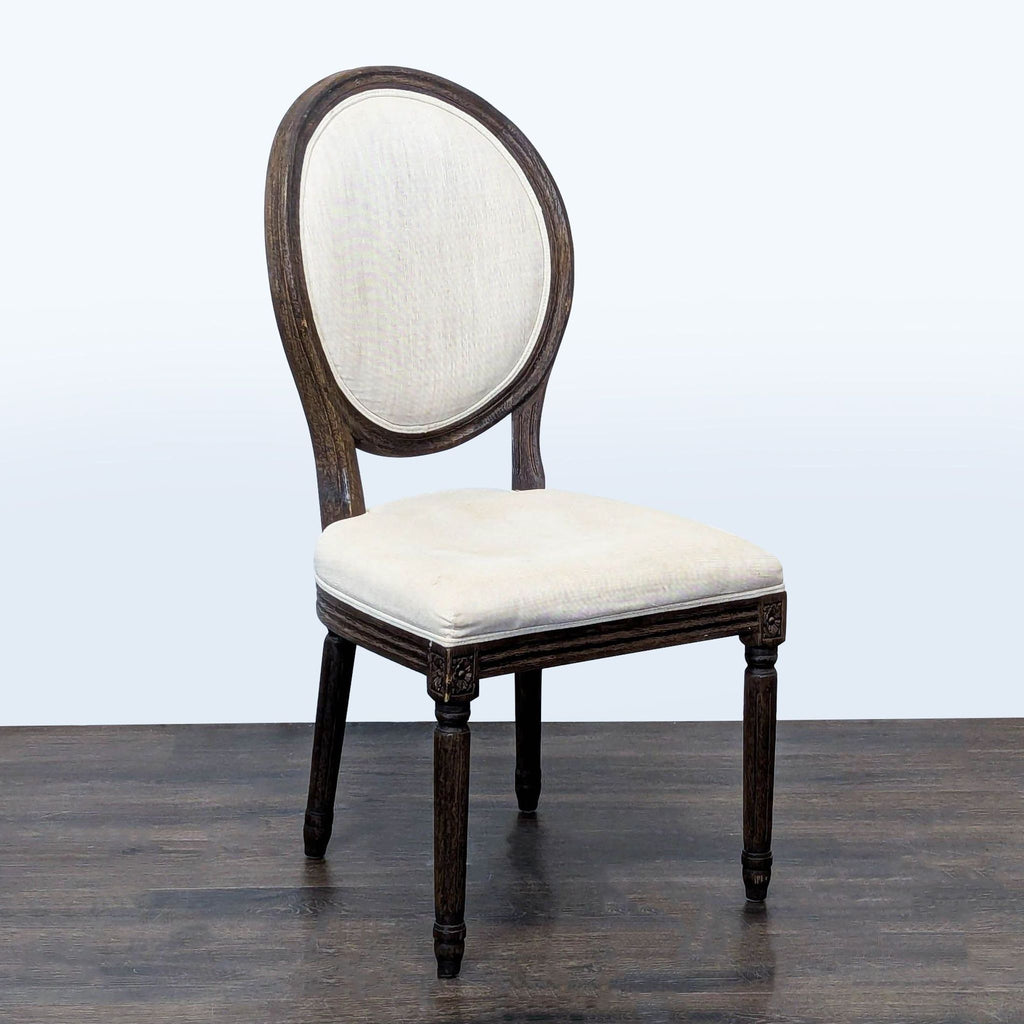 Restoration Hardware dining chair featuring French design, upholstery, and ornate carvings.  