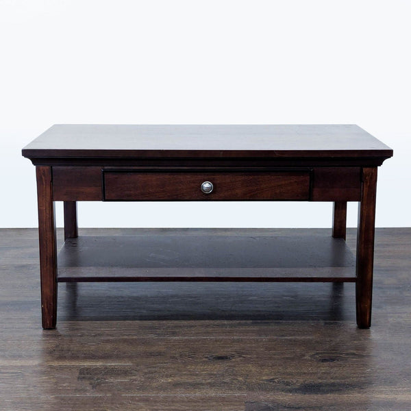 1. Dark wood coffee table with a single drawer and lower shelf, shown on a hardwood floor, front view.