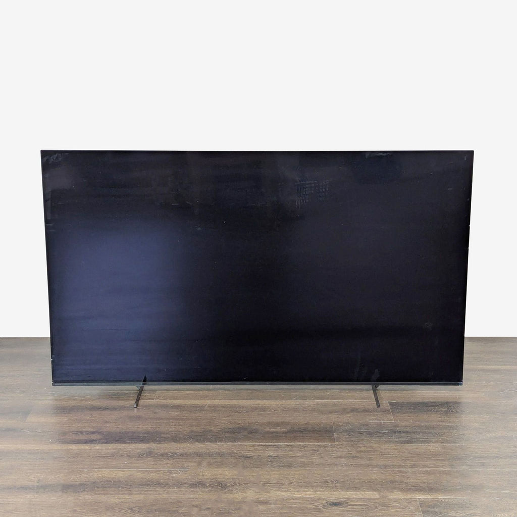 Sony TV with 55-inch 4K screen, Google TV interface, and streaming app icons, shown in modern good condition.  