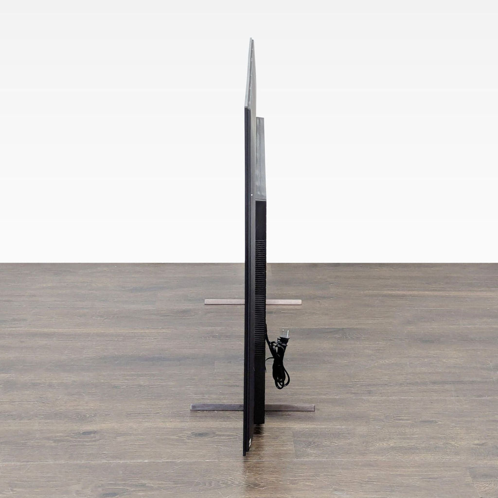 Front view of a Sony 55-inch 4K Smart TV in excellent condition, featuring Google TV and sturdy legs.