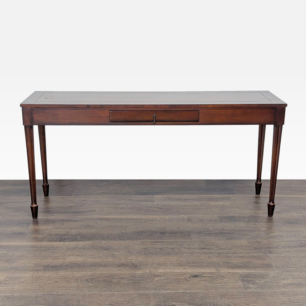 1. Rectangular wooden console table with tapered legs and a central drawer, shown on a wood floor.