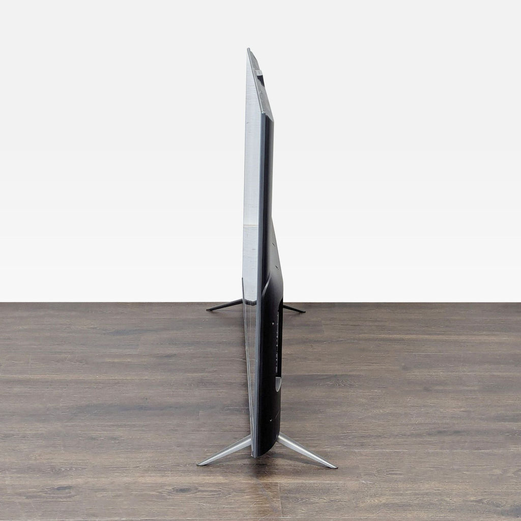 Amazon brand TV featuring ultra-high definition 4K screen, built-in apps, and a modern, slim profile design.