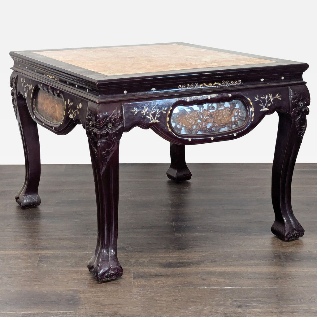 3. Ornate end table with floral and figure carvings, pink marble top, and detailed mother of pearl inlay on each side.