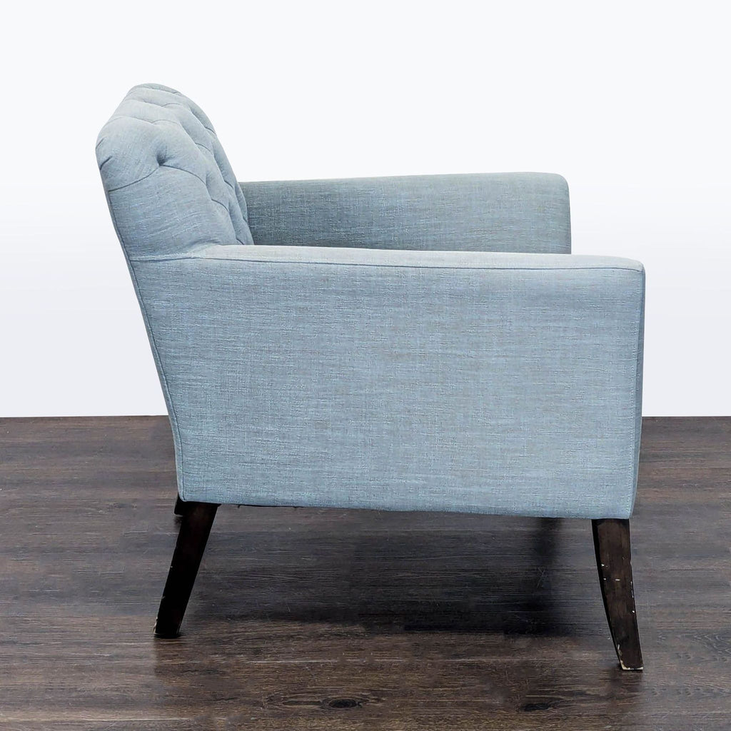 1. Modern West Elm lounge chair with plush upholstery and sleek metal legs.