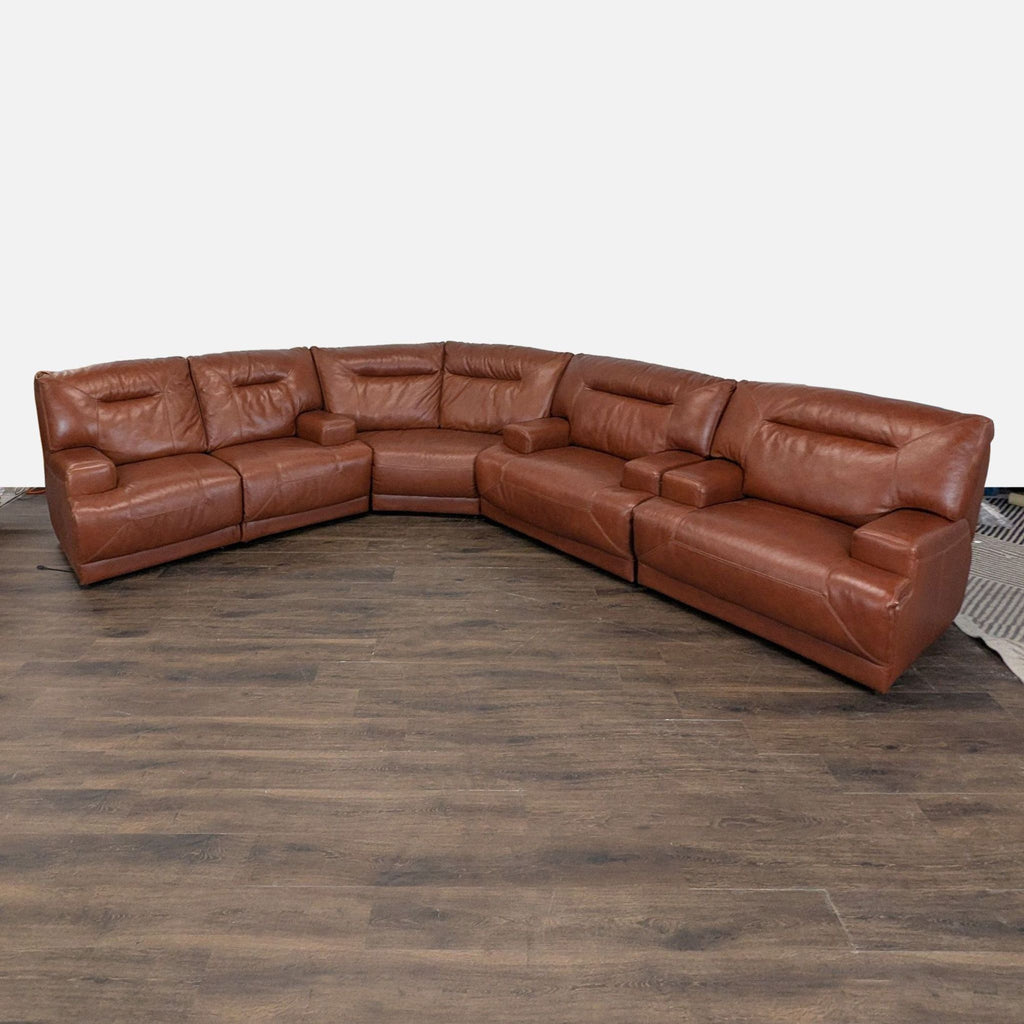 1. Large brown leather sectional with built-in armrests and a corner design, offering spacious seating for any living room.
