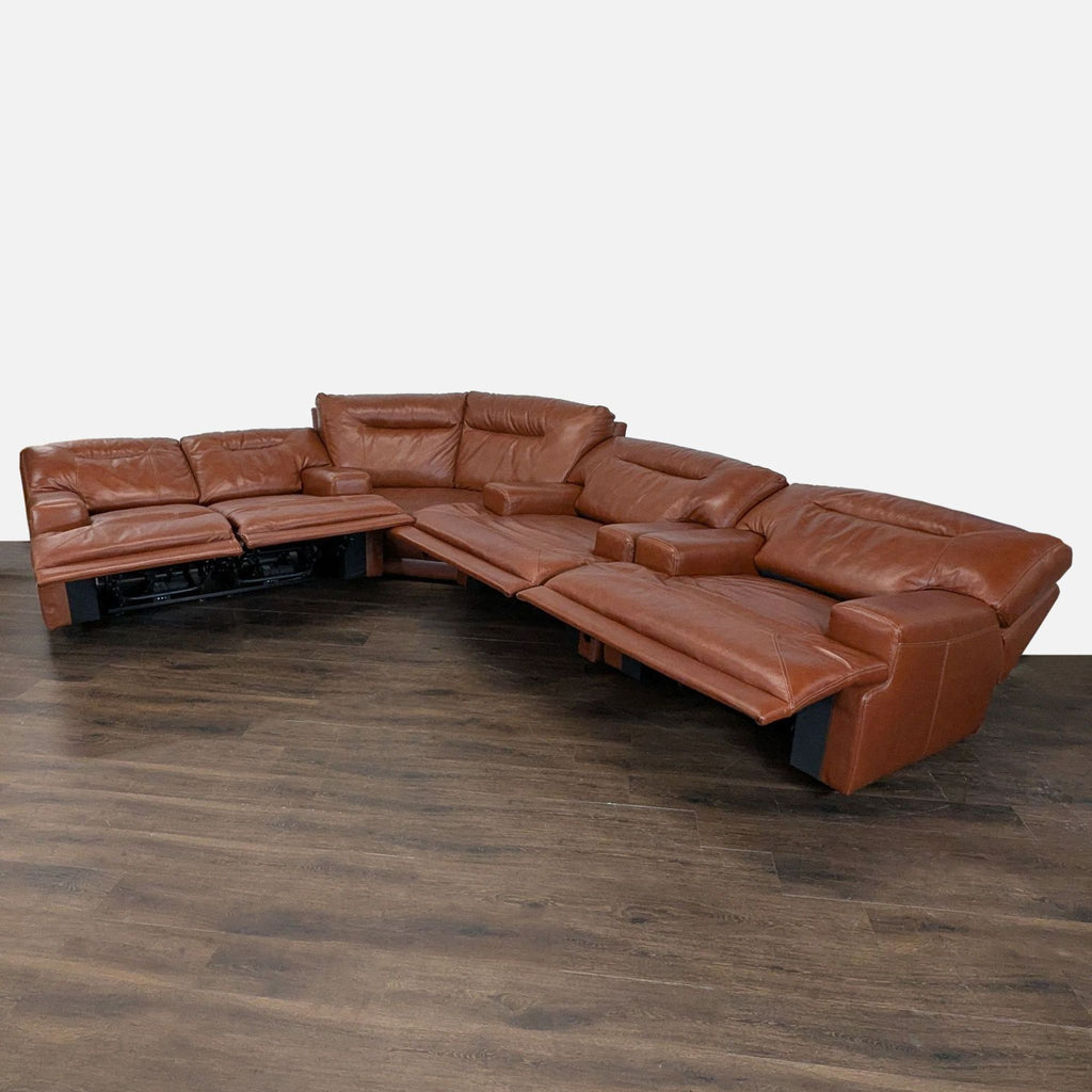 2. Brown leather sectional with multiple reclining seats, perfect for maximizing space and providing extra comfort.