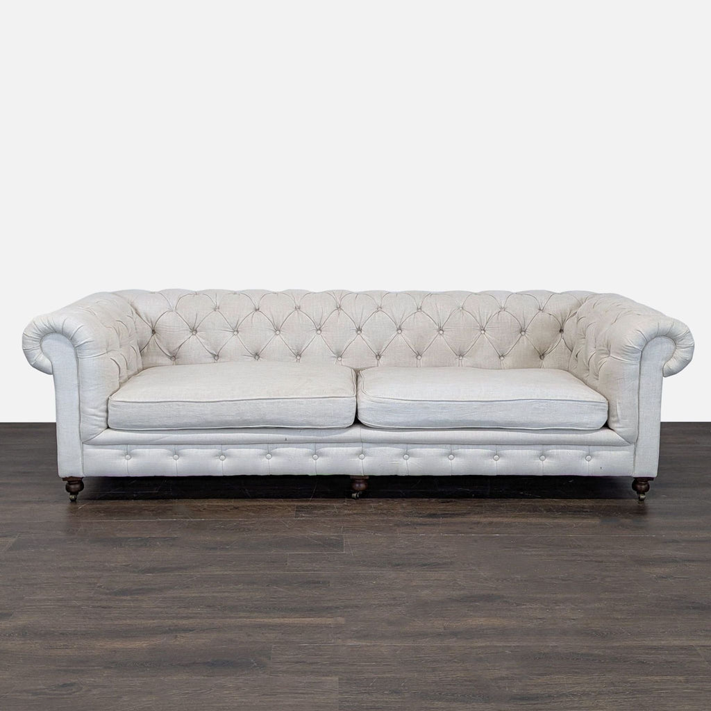Restoration Hardware 3-seat Chesterfield sofa with deep tufting, light linen upholstery, and rolled arms.  