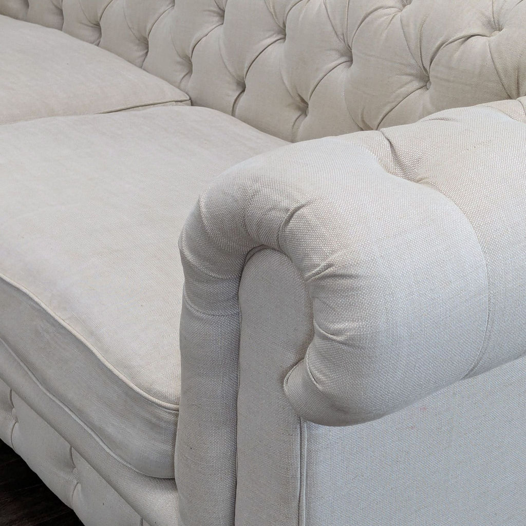 Timeless Chesterfield sofa by Restoration Hardware, featuring spacious seating and cushioned comfort.