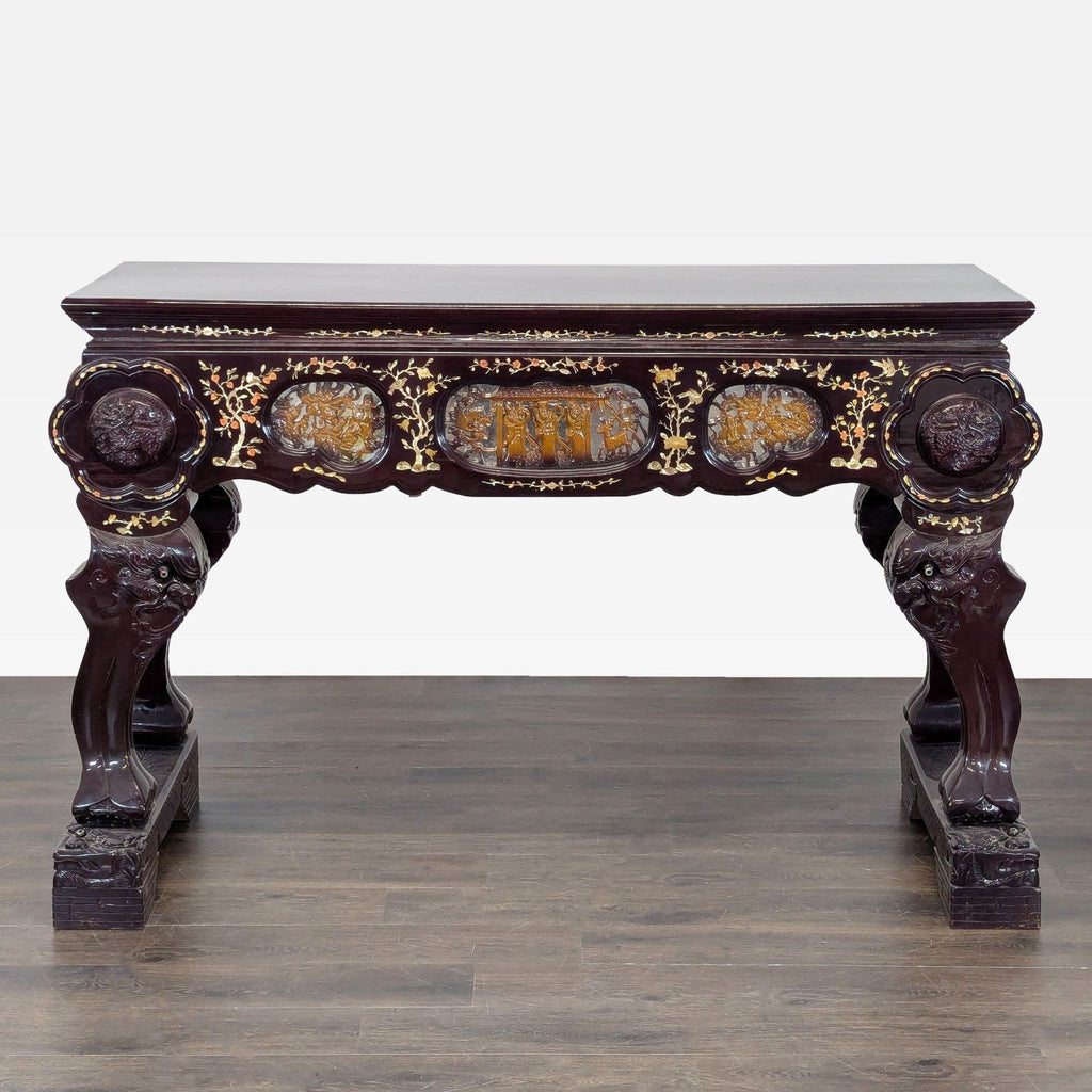 Ornate side table with deity-shaped base, two drawers, and intricate animal, figure, and floral carvings.  