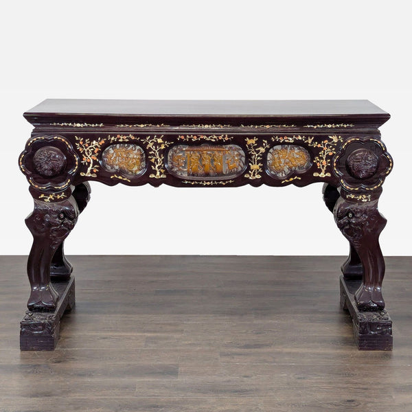 Ornate side table with deity-shaped base, two drawers, and intricate animal, figure, and floral carvings.  