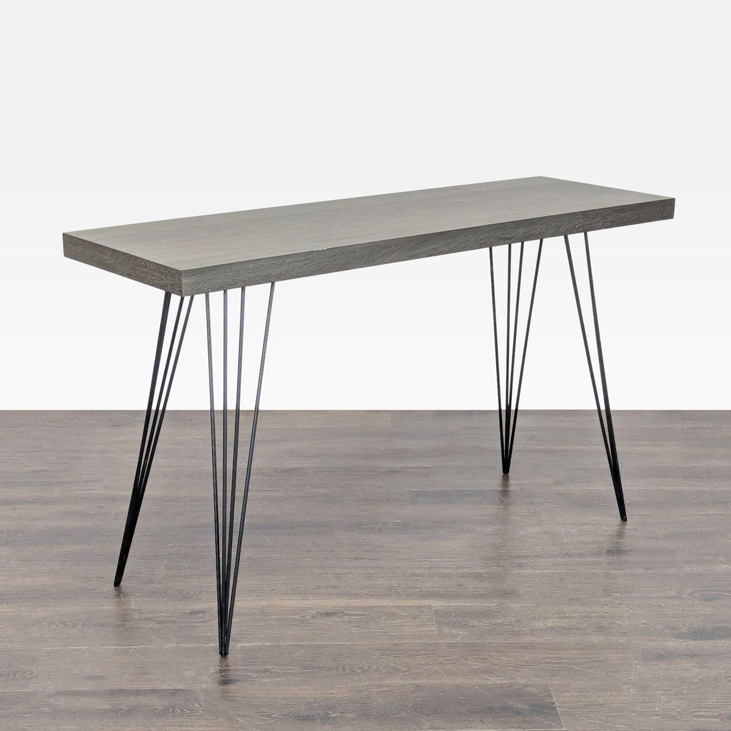 1. Modern side or console table with a gray wood top and slender black metal hairpin legs, on wood floor.
