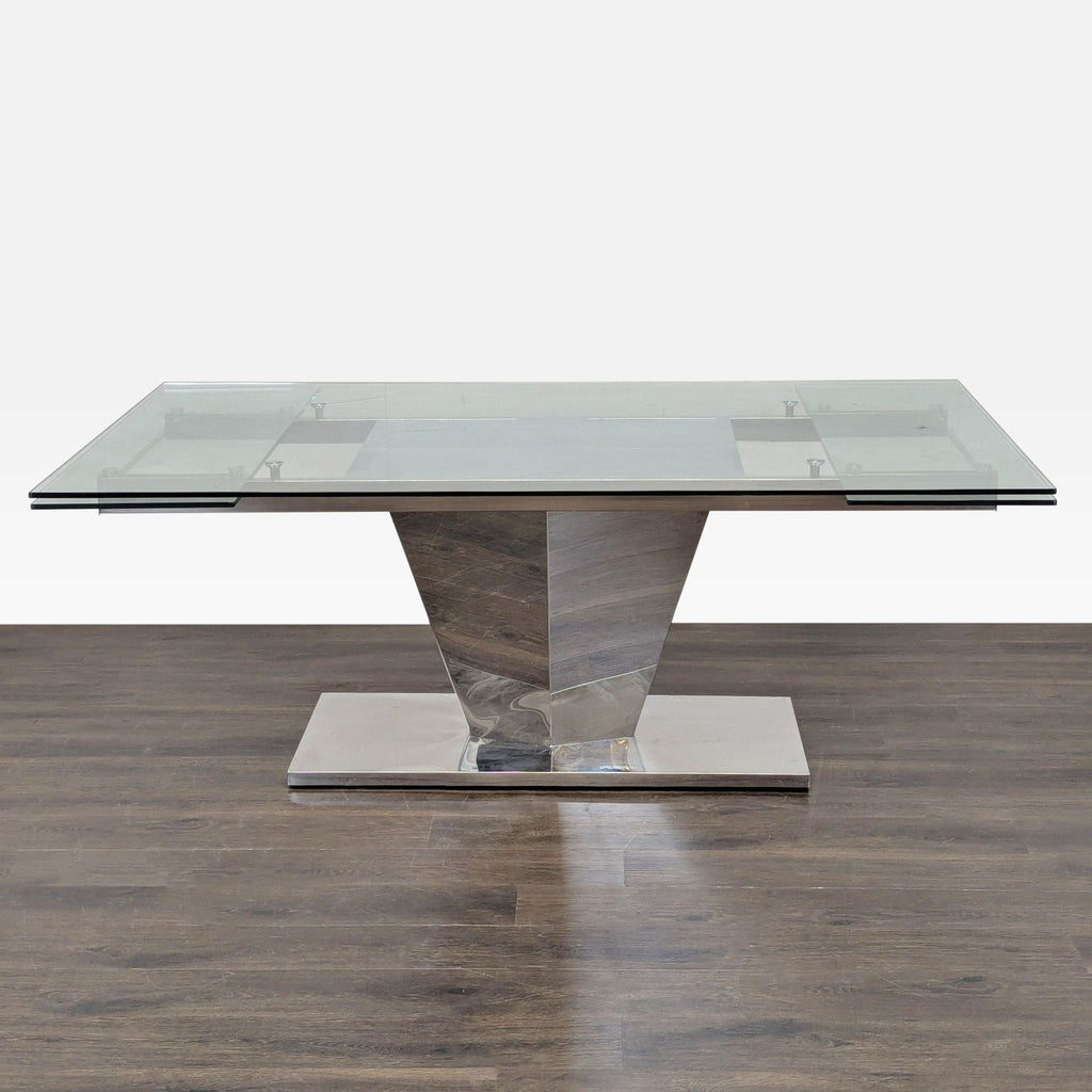 1. Modern glass dining table with a geometric metal base, shown on wood flooring, expands to 110.75 inches.