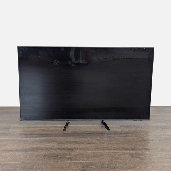 Samsung 65-inch 4K UHD Smart TV with sturdy legs, sleek design, and popular streaming apps displayed on screen.