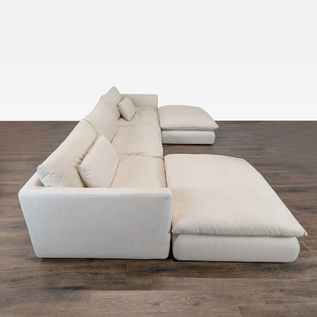 Modern beige sectional sofa from Crate & Barrel featuring roomy seating and soft, clean-lined design.  