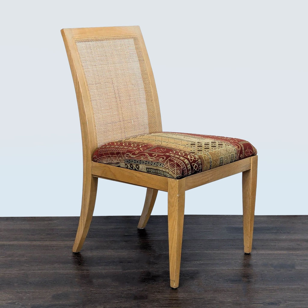 3. Single dining chair with natural wood frame, cane back, and patterned upholstered seat on a dark wood floor.