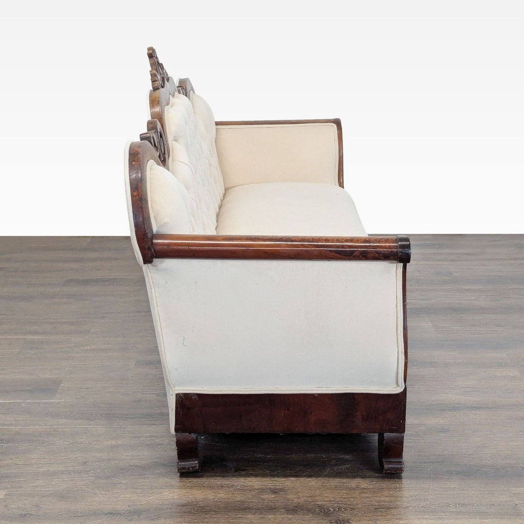 Classic 3-seat couch featuring detailed woodwork and plush cream upholstery, ideal for cozy lounges or living rooms.