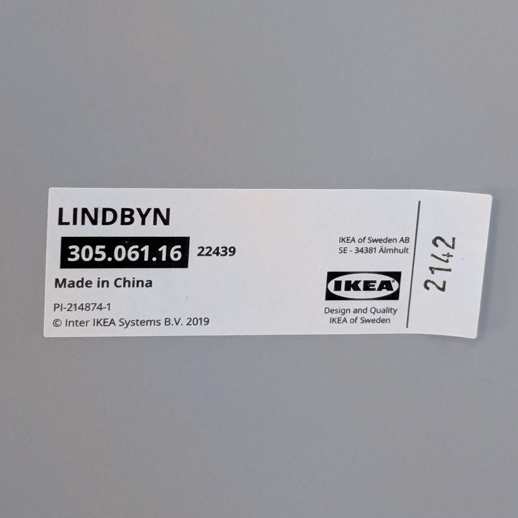 1. Close-up of an IKEA Lindbyn mirror product label with model number 305.061.16.