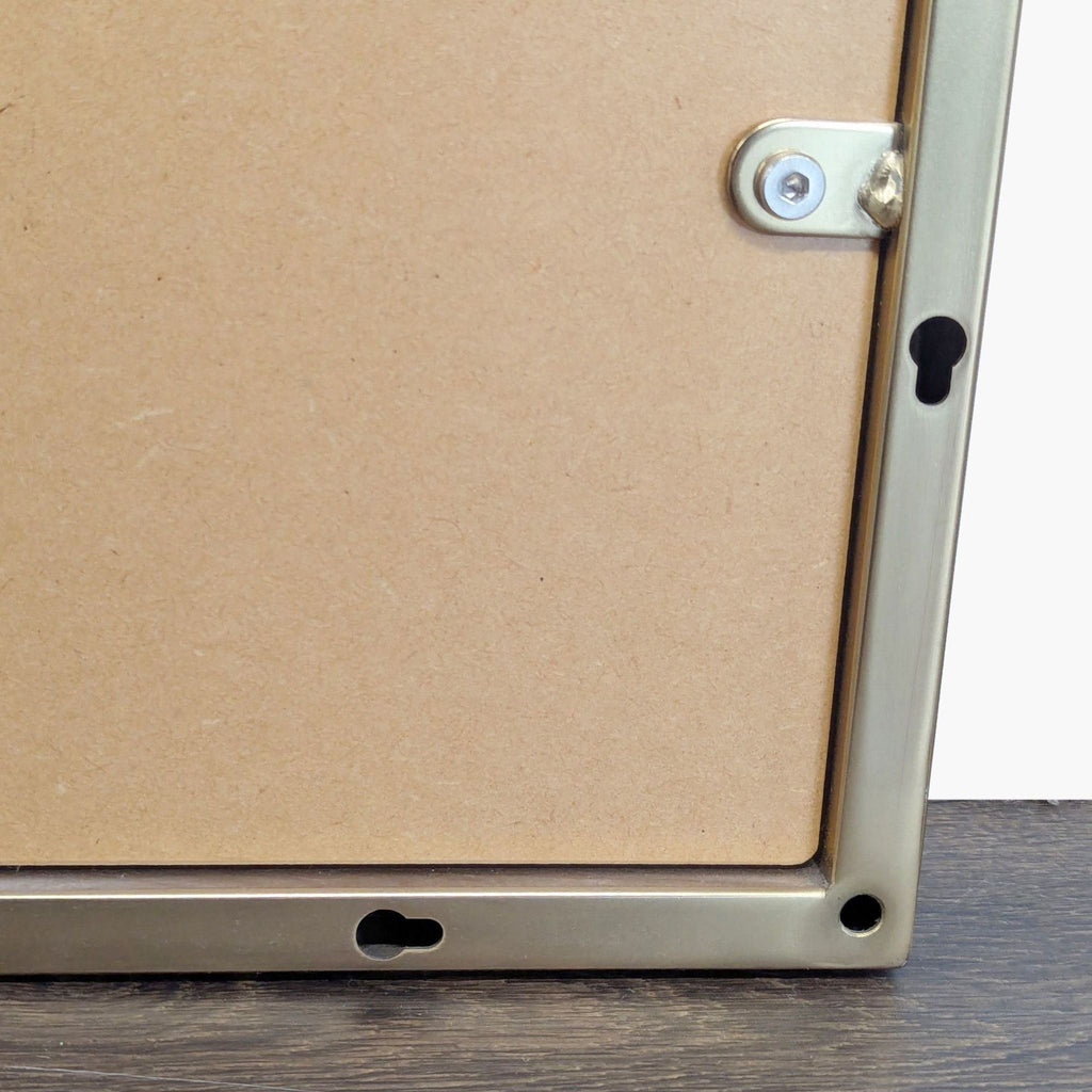 West Elm circular wall mirror with thin metal frame, reflecting modern minimal style.