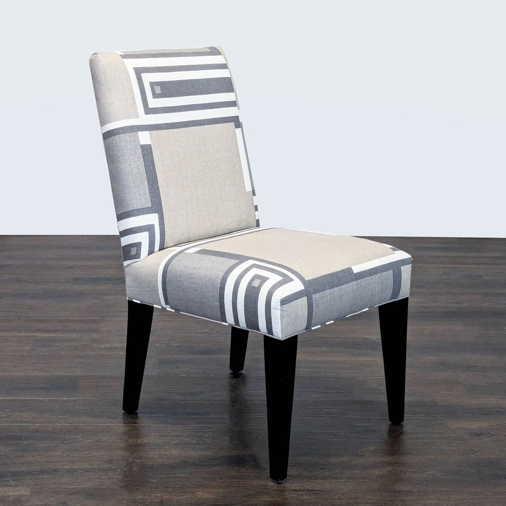 1. Contemporary Mitchell Gold + Bob Williams dining chair with fabric upholstery and slender wood legs.